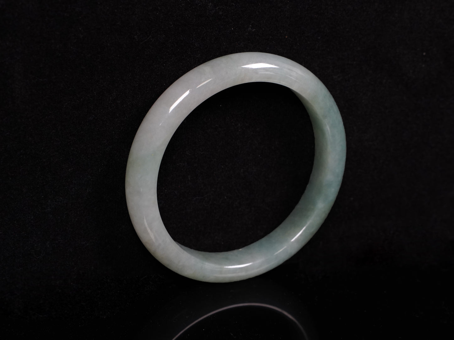 A mist green gentle luster jadeite bangle.