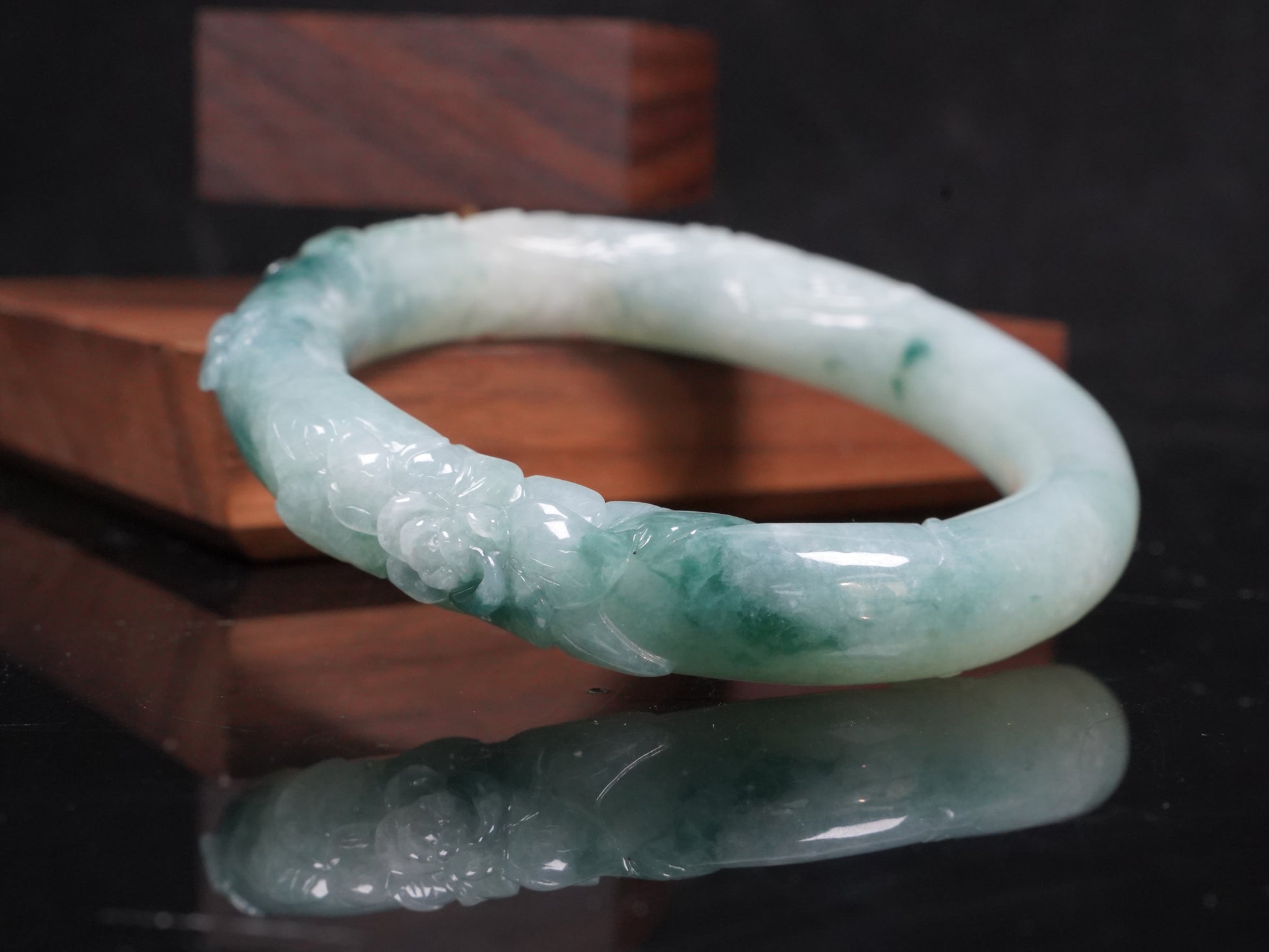 Milky white with blue green veins and floral carvings Jadeite Bangle.