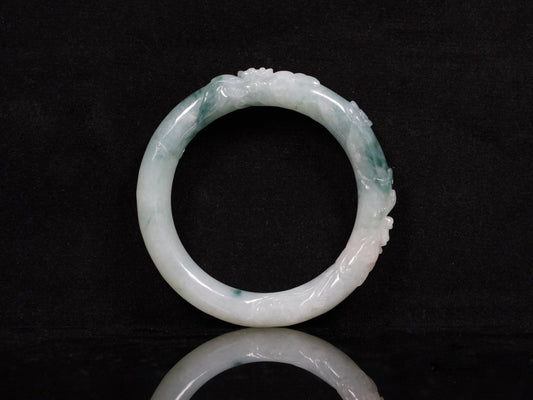 Milky white with blue green veins and floral carvings Jadeite Bangle.
