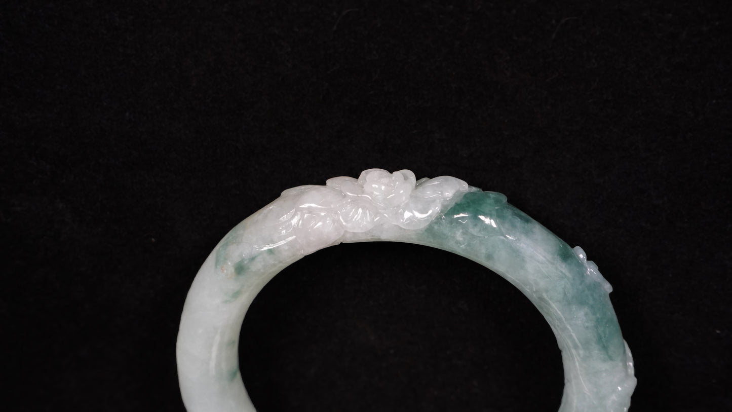 Milky white with blue green veins and floral carvings Jadeite Bangle.