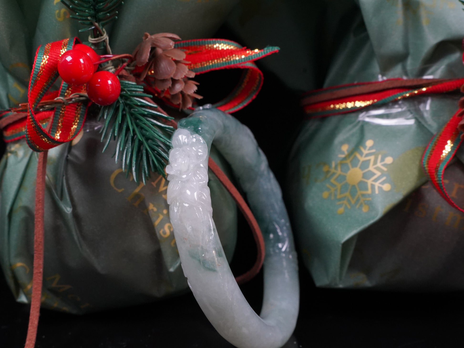 Milky white with blue green veins and floral carvings Jadeite Bangle.