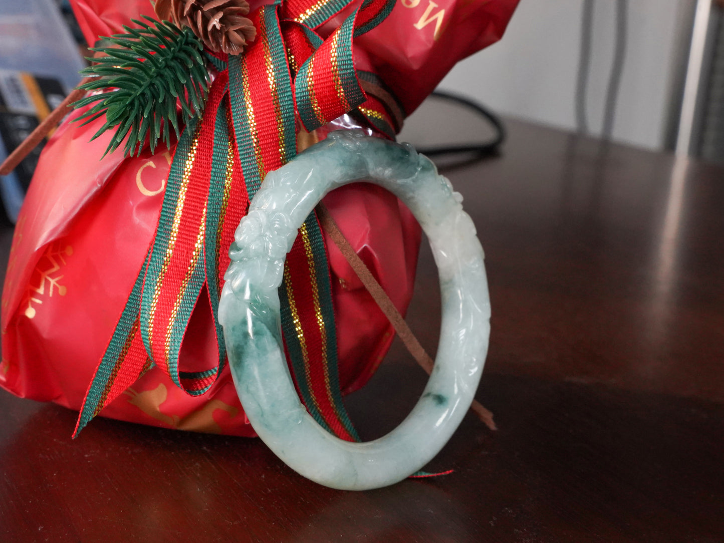 Milky white with blue green veins and floral carvings Jadeite Bangle.