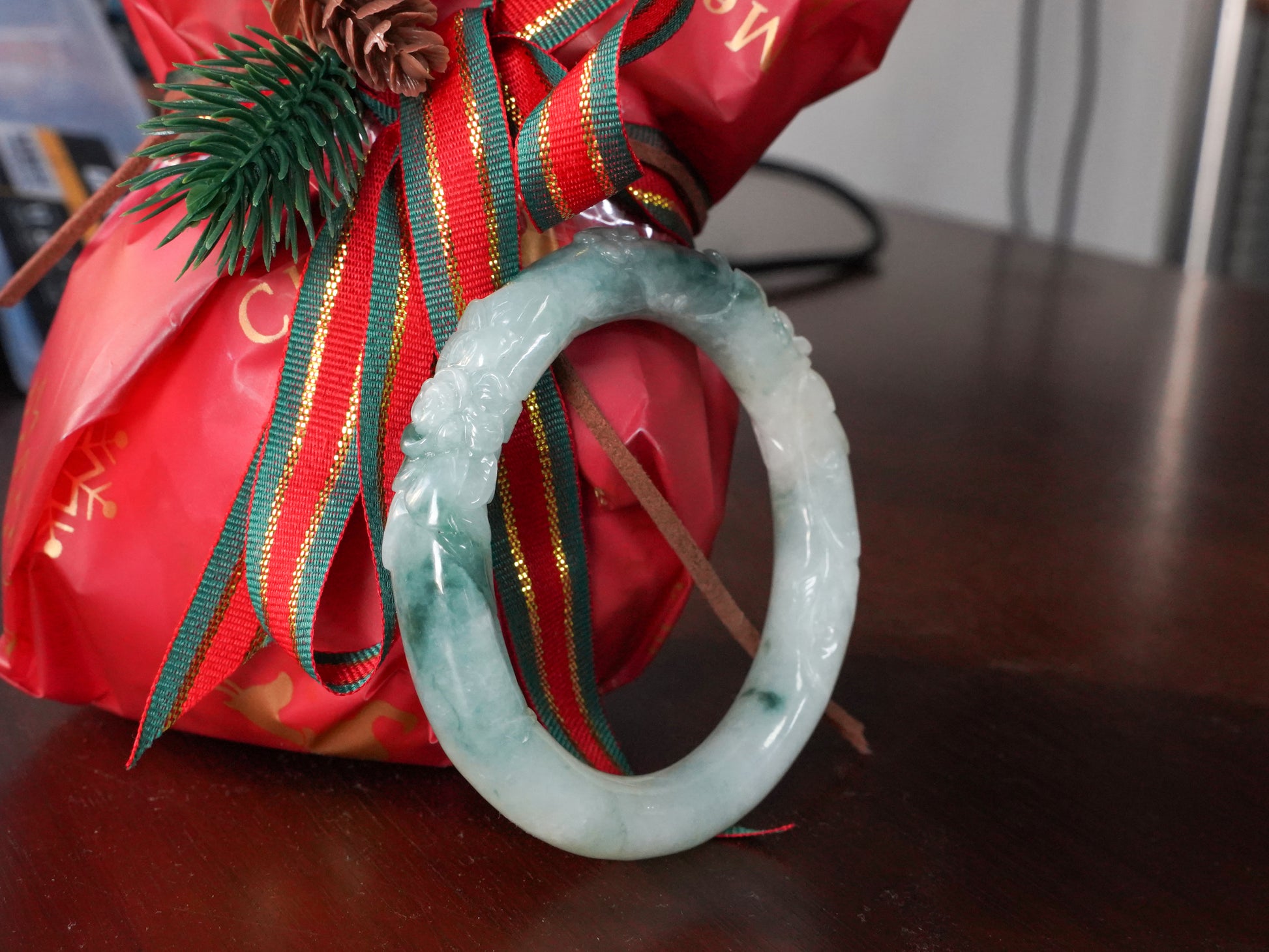 Milky white with blue green veins and floral carvings Jadeite Bangle.