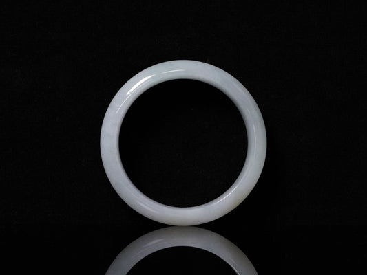 A pale frosty jadeite bangle.