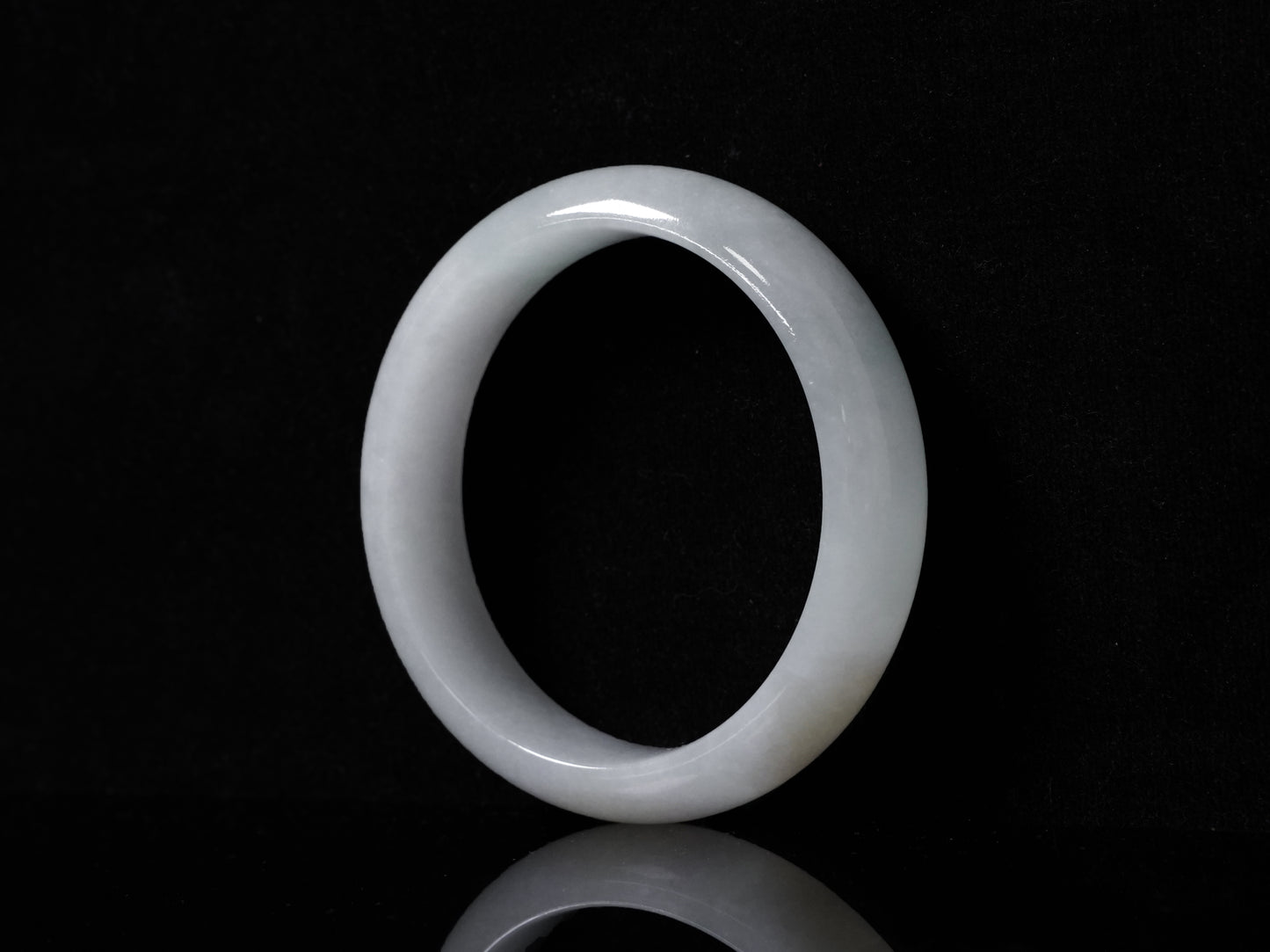 A pale frosty jadeite bangle.