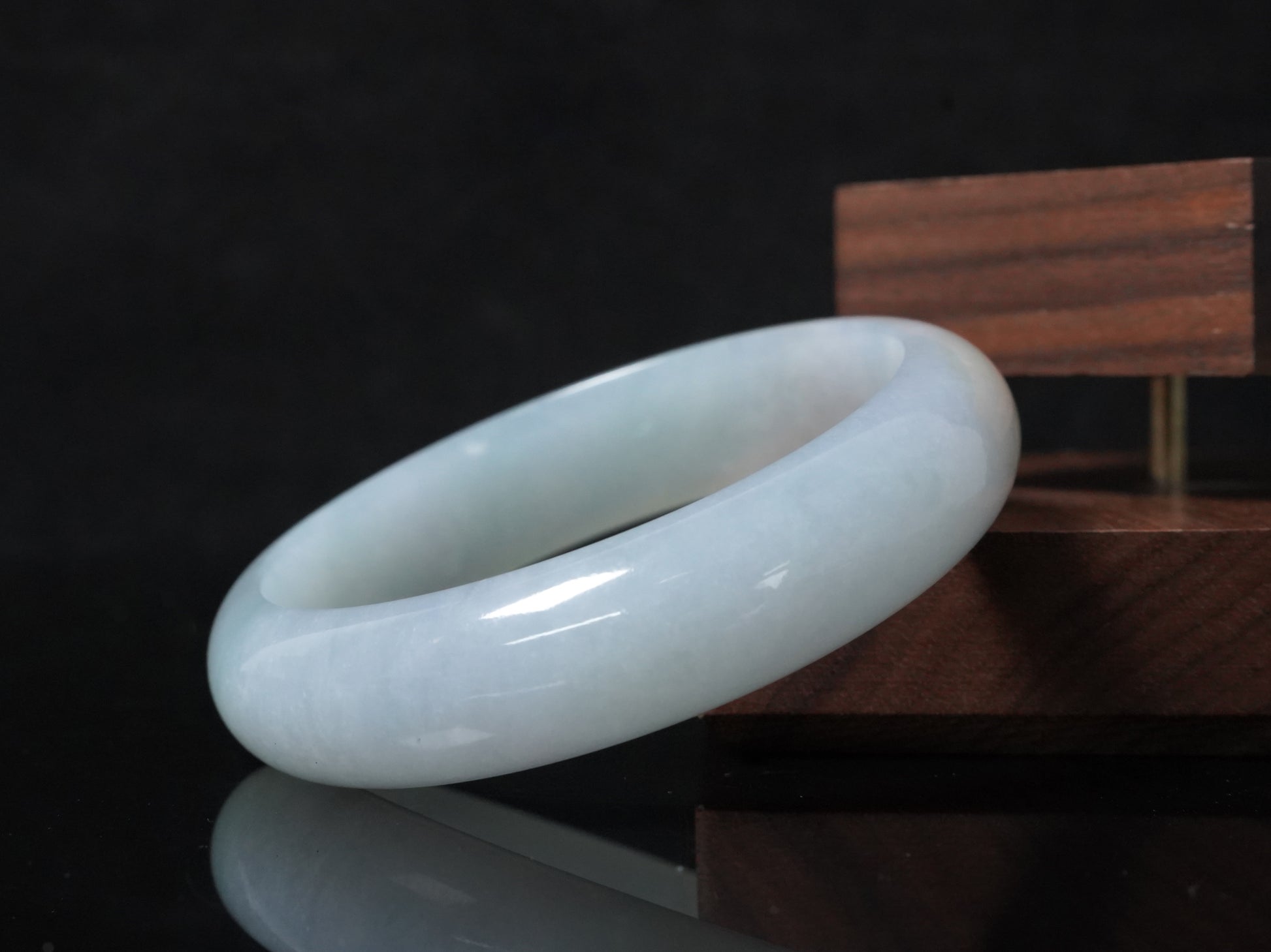 A pale frosty jadeite bangle.