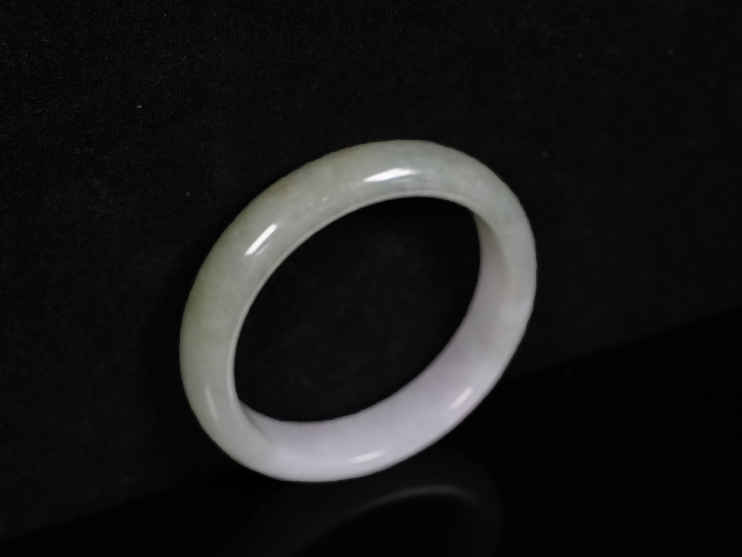 A half white half pale green dual tone  jadeite bangle.