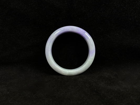 A white and purple jadeite bangle.