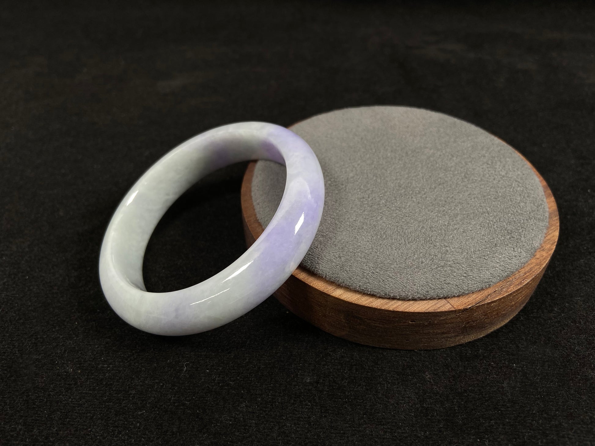 A white and purple jadeite bangle.
