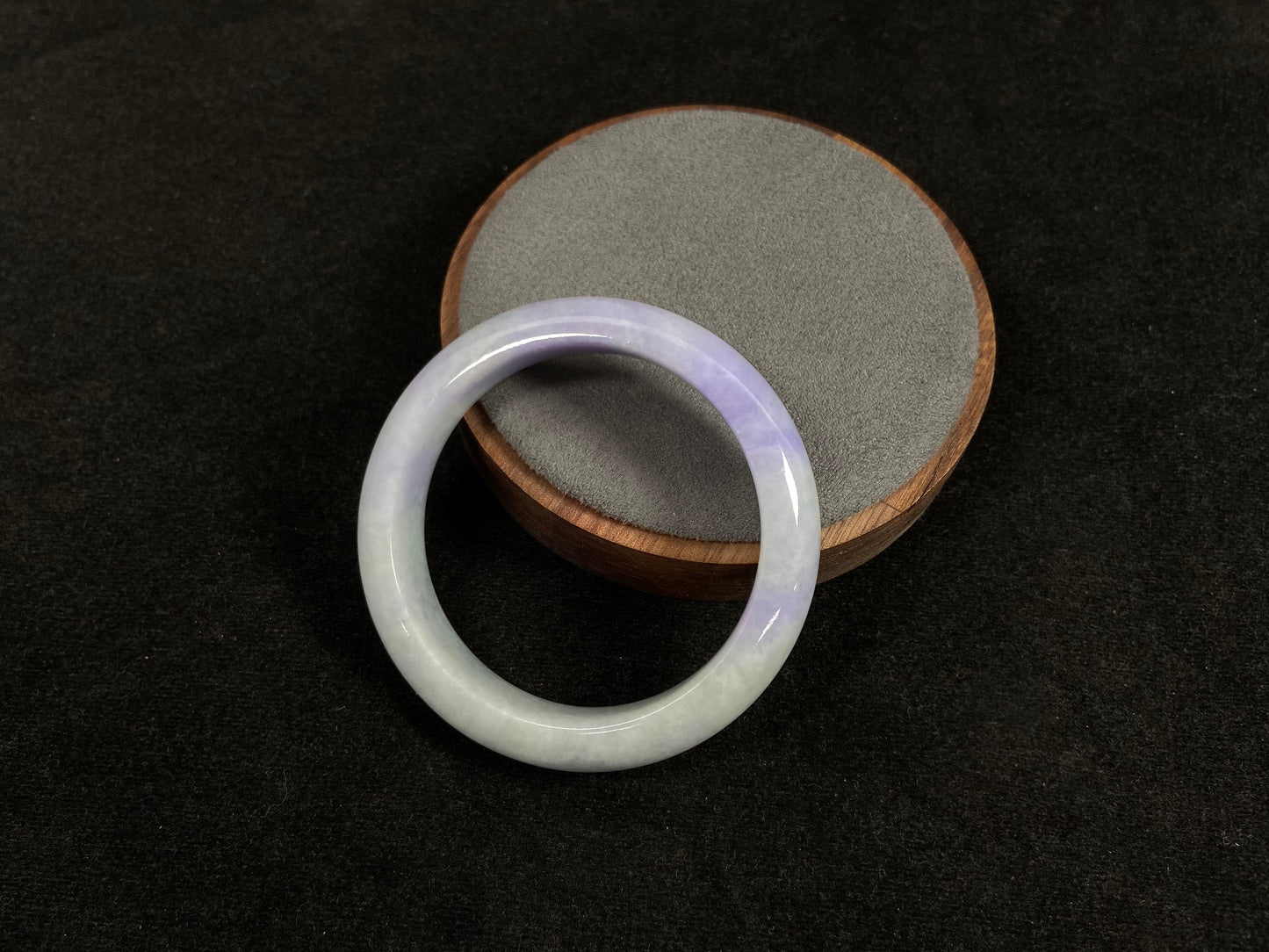 A white and purple jadeite bangle.