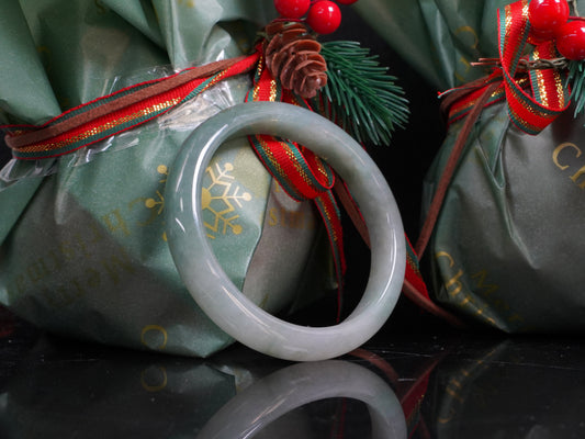 A misty green white jadeite bangle.