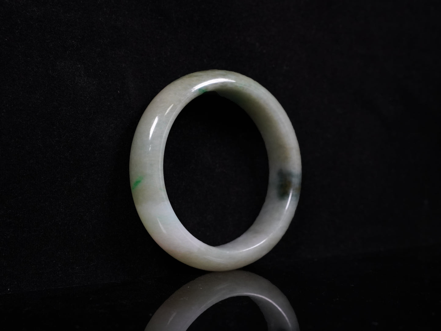 A soft greenish-aqua with natural veins  jadeite bangle.