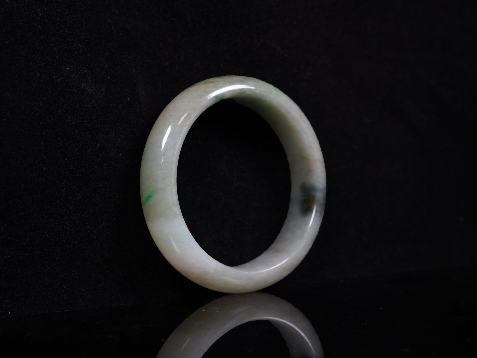 A soft greenish-aqua with natural veins  jadeite bangle.