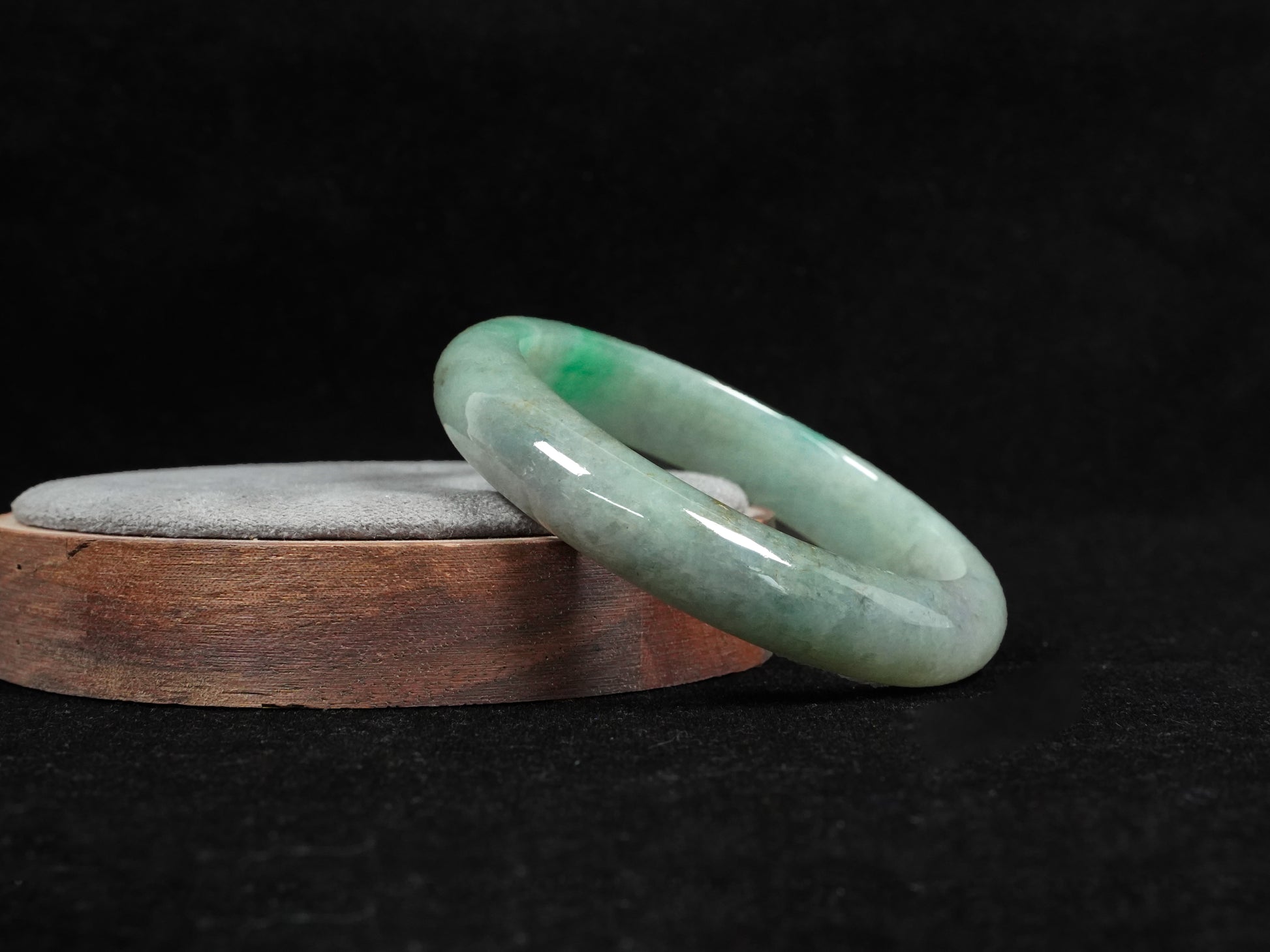 A misty green base, graced with floating deep green accents and a whisper of grey.