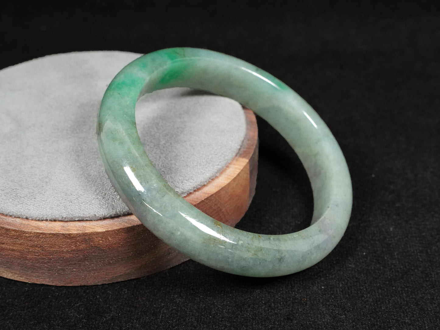 A misty green base, graced with floating deep green accents and a whisper of grey.