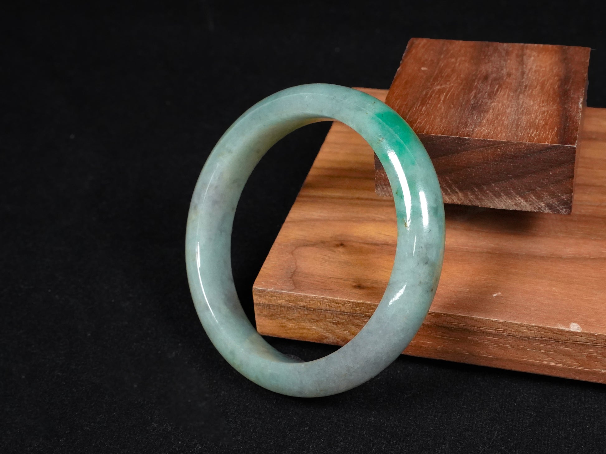 A misty green base, graced with floating deep green accents and a whisper of grey.