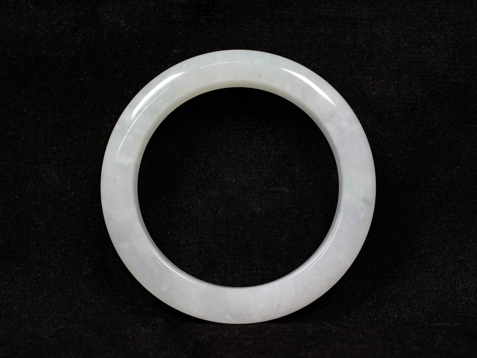 A milky white-hued jadeite bangle.