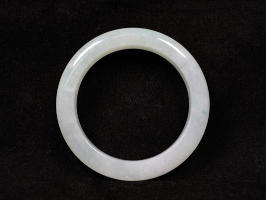 A milky white-hued jadeite bangle.