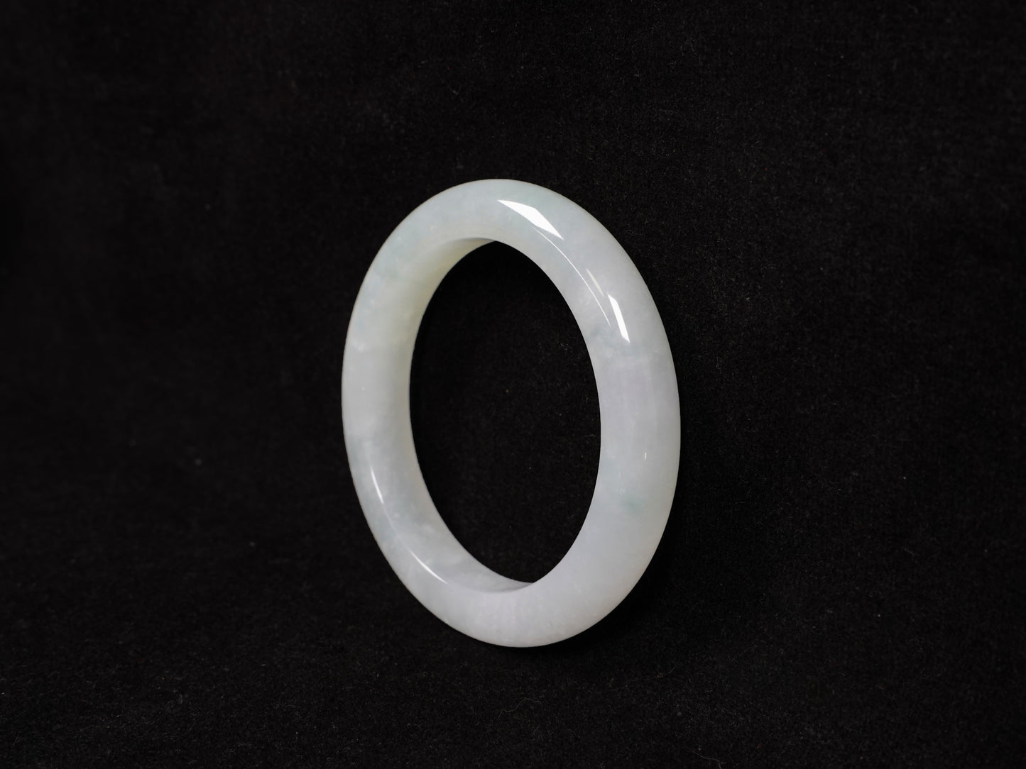 A milky white-hued jadeite bangle.