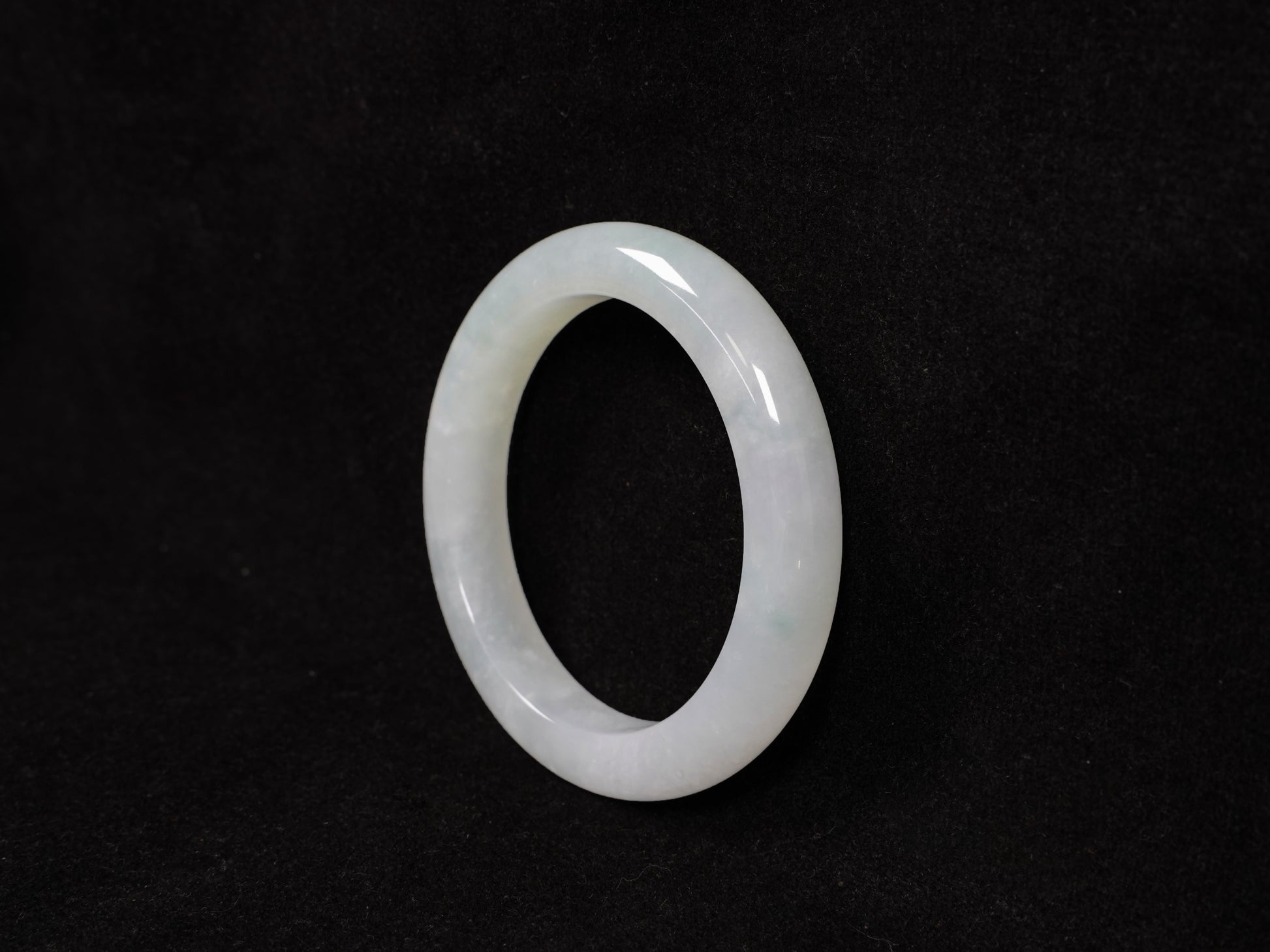 A milky white-hued jadeite bangle.