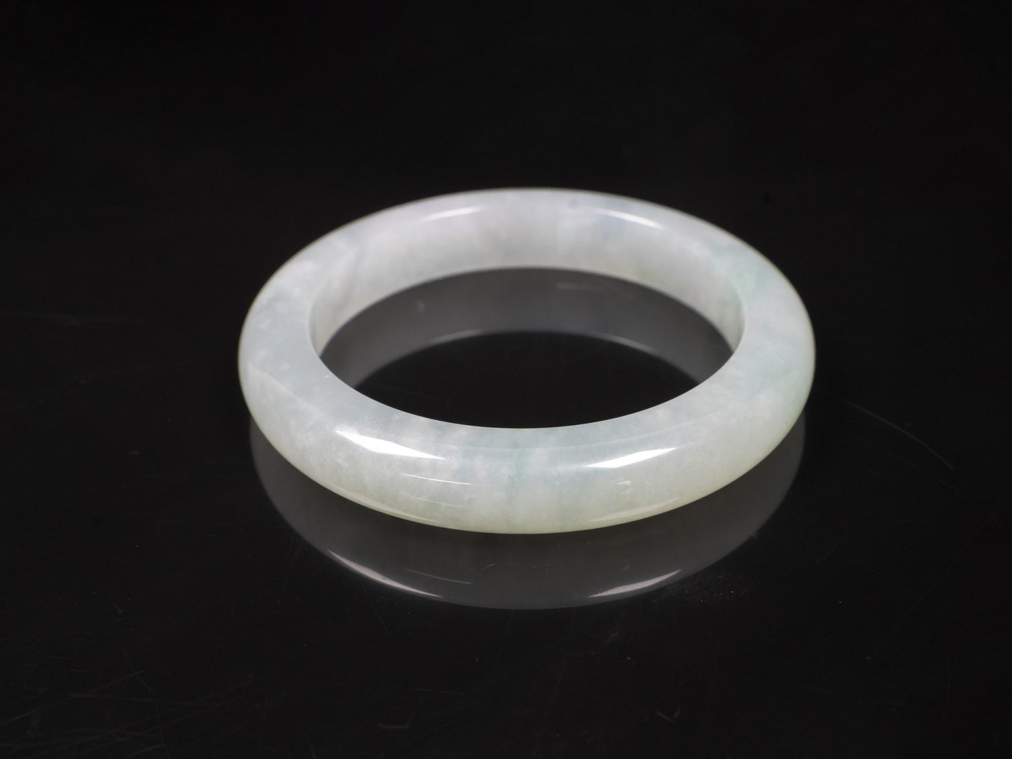 A milky white-hued jadeite bangle.