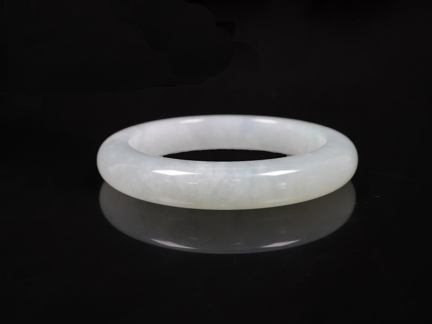 A milky white-hued jadeite bangle.