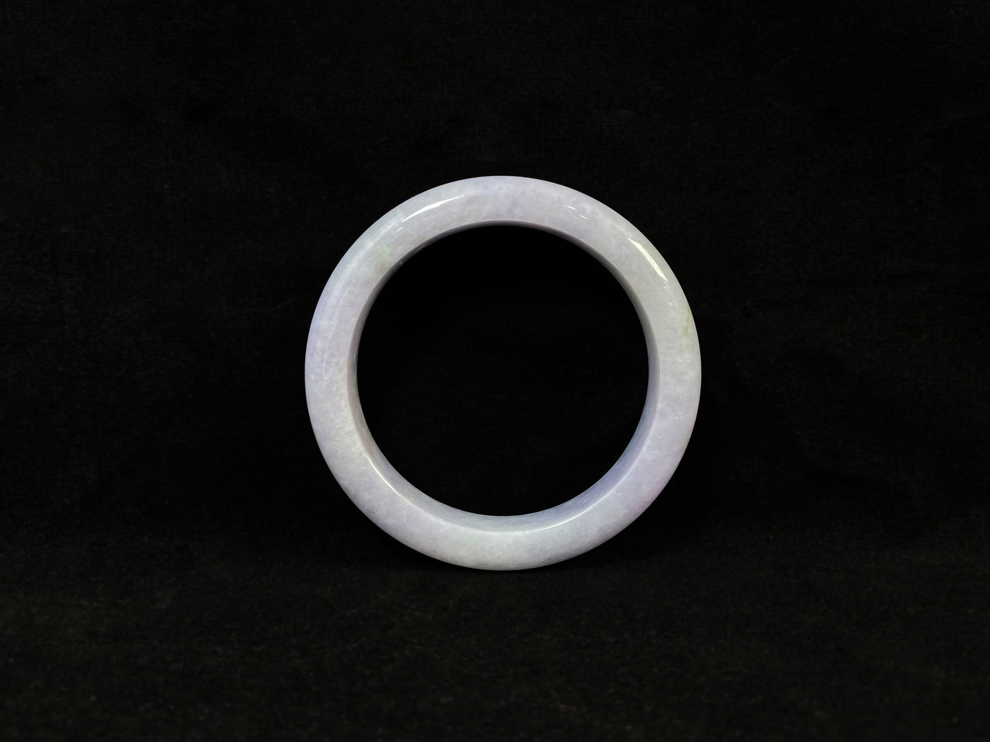 A delicate lavender jade bangle.