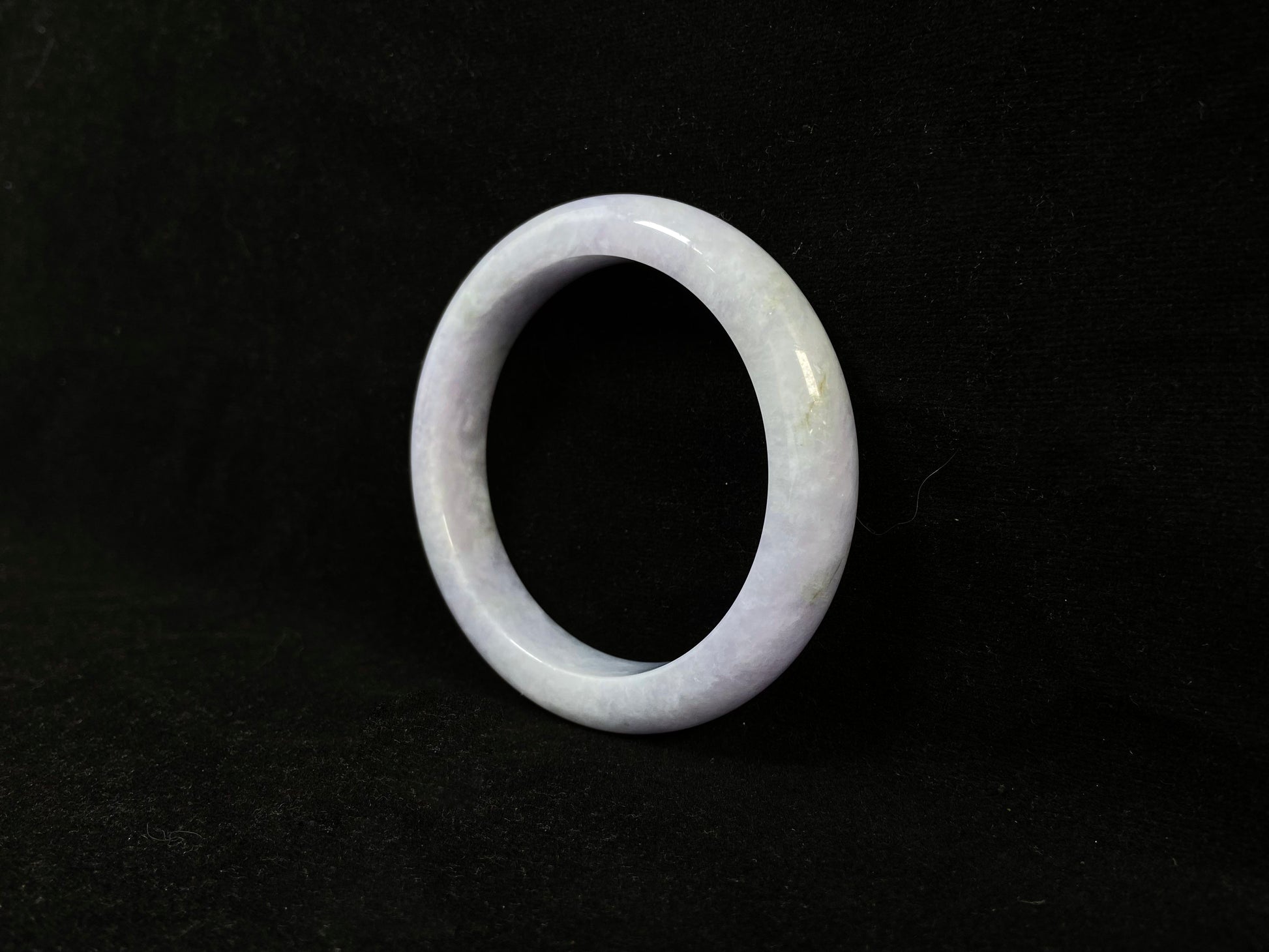 A delicate lavender jade bangle.