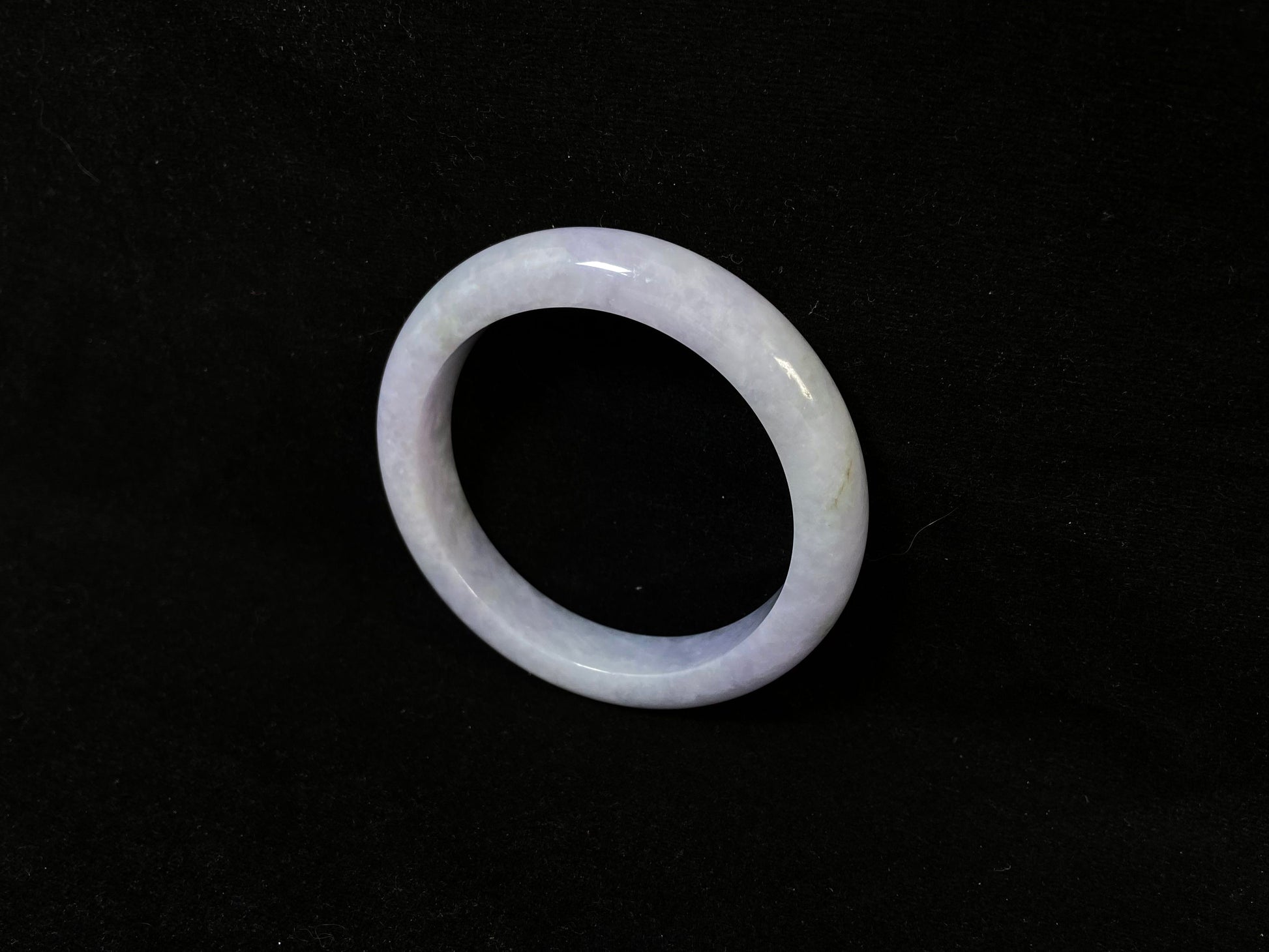 A delicate lavender jade bangle.
