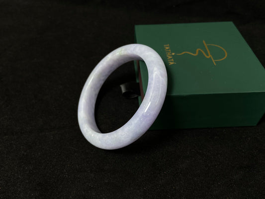 A delicate lavender jade bangle.