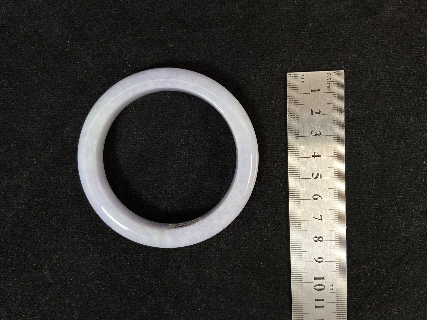 A delicate lavender jade bangle.