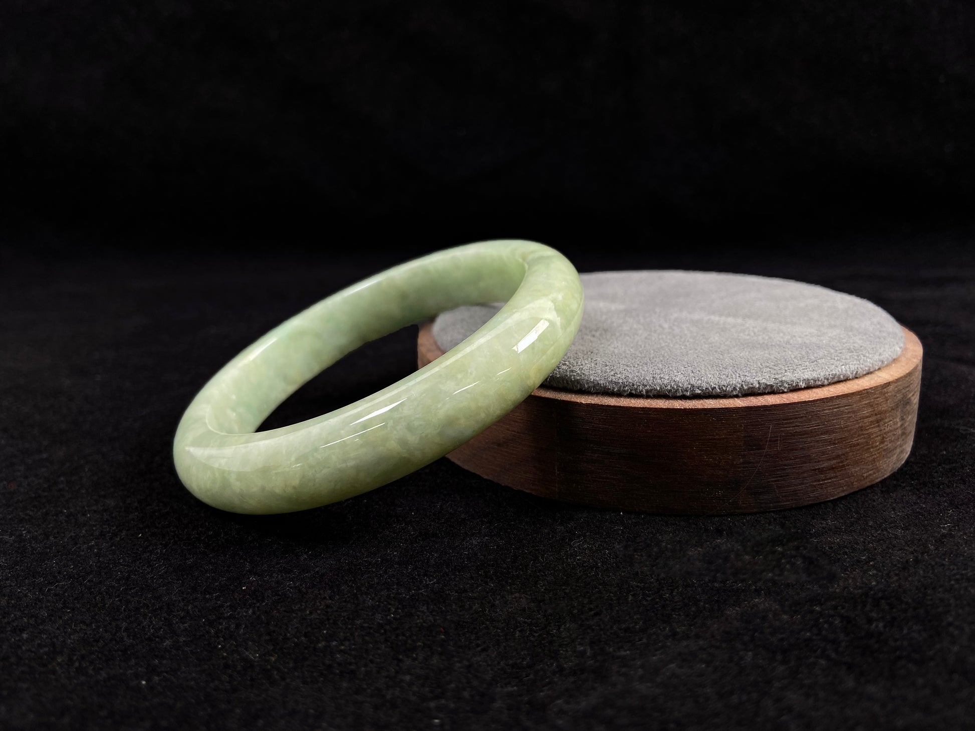 A soothing pea green jade bangle.