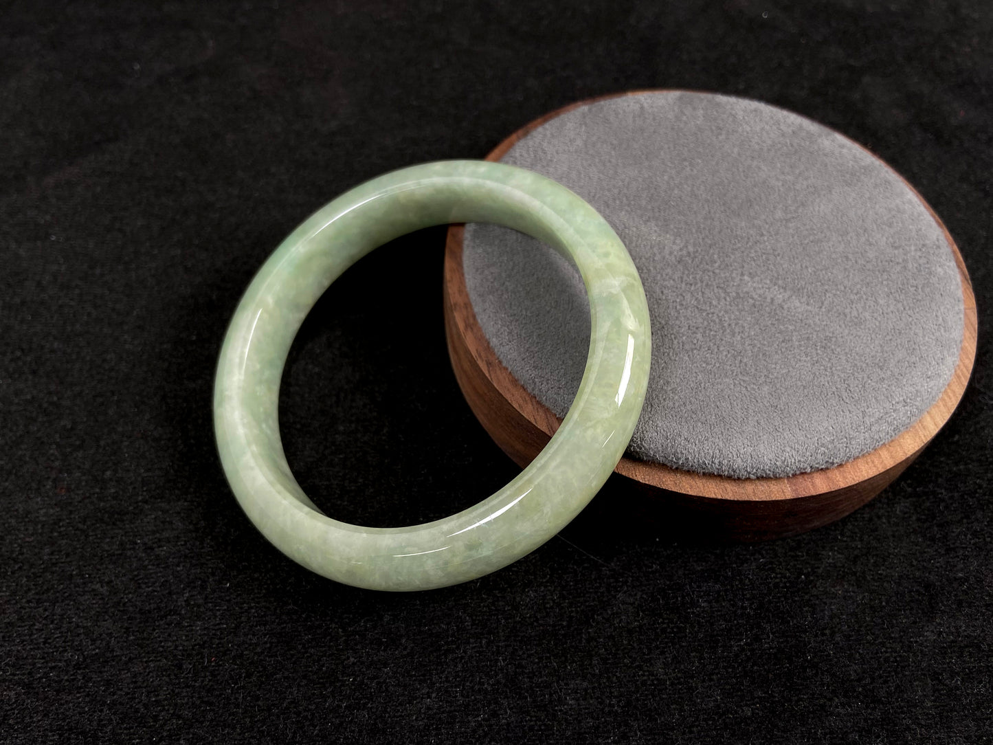 A soothing pea green jade bangle.