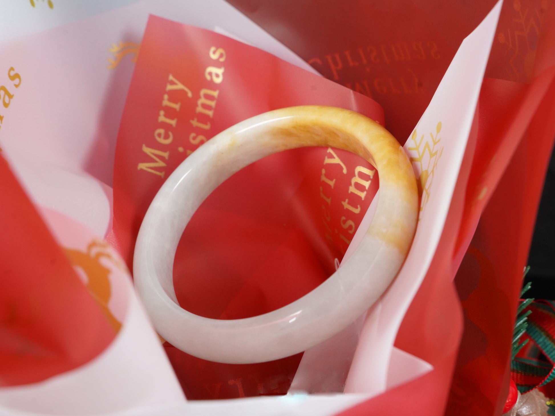 A ivory base with warm amber accent  jadeite bangle.