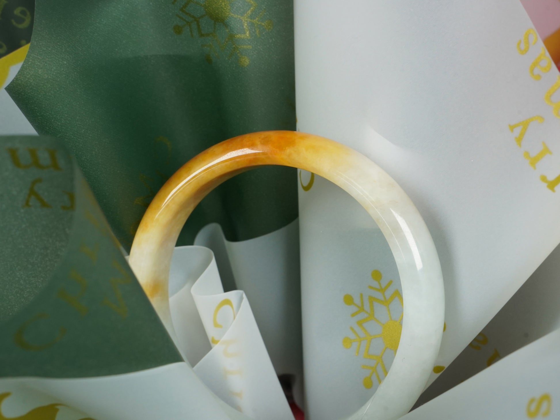 A ivory base with warm amber accent  jadeite bangle.