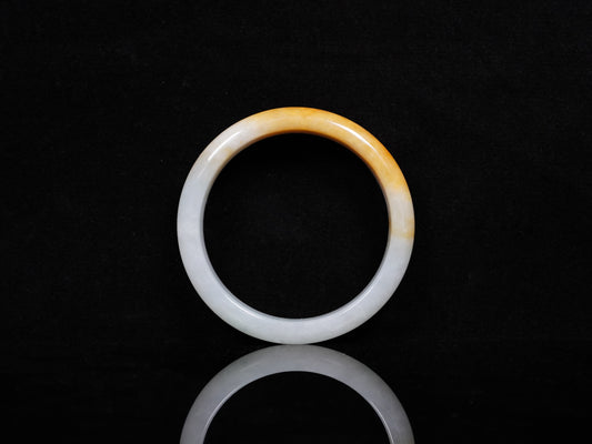 A ivory base with warm amber accent  jadeite bangle.