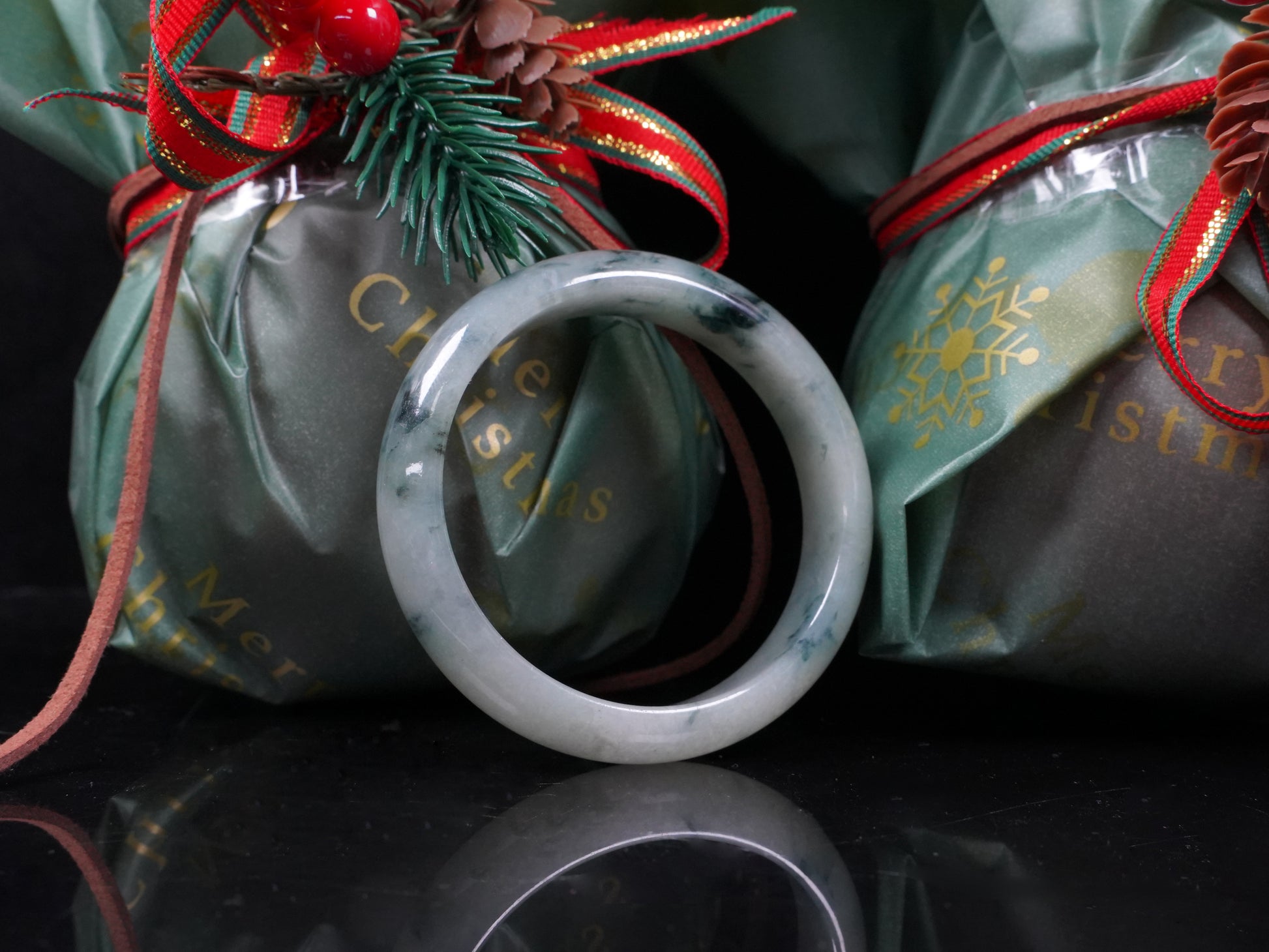 A misty teal veins jadeite bangle.