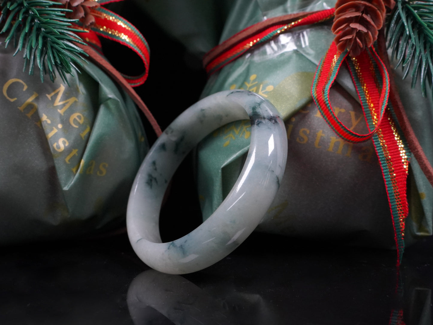 A misty teal veins jadeite bangle.