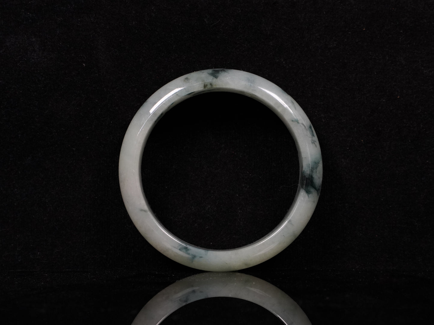 A misty teal veins jadeite bangle.