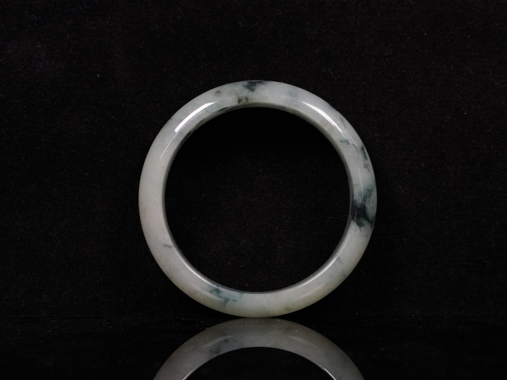 A misty teal veins jadeite bangle.