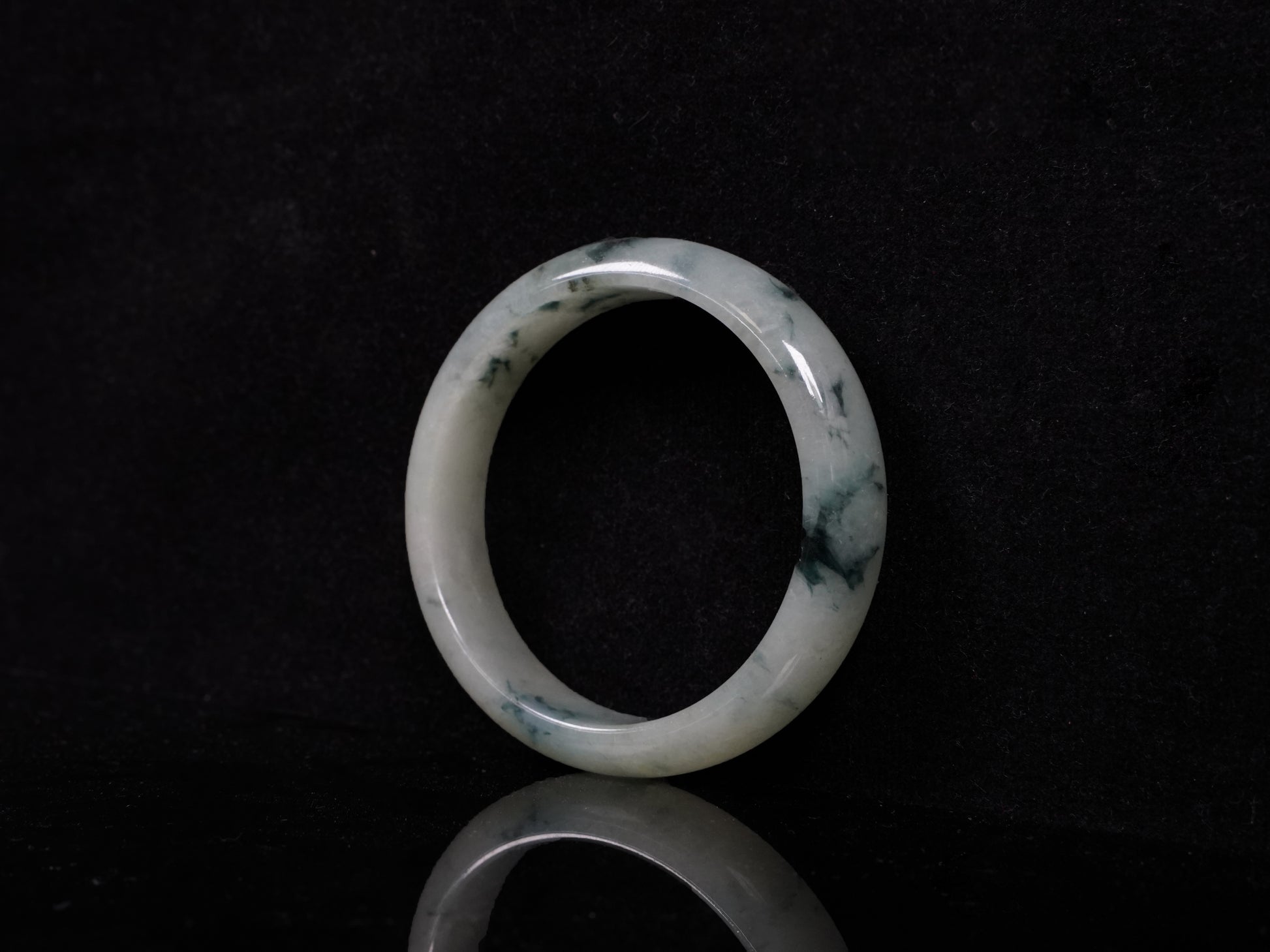 A misty teal veins jadeite bangle.