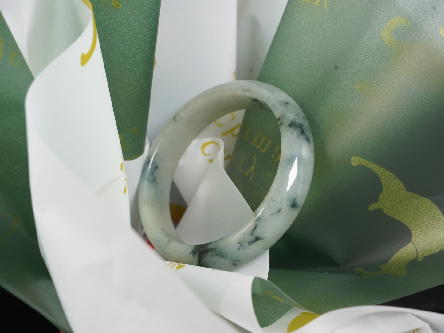 A misty teal veins jadeite bangle.