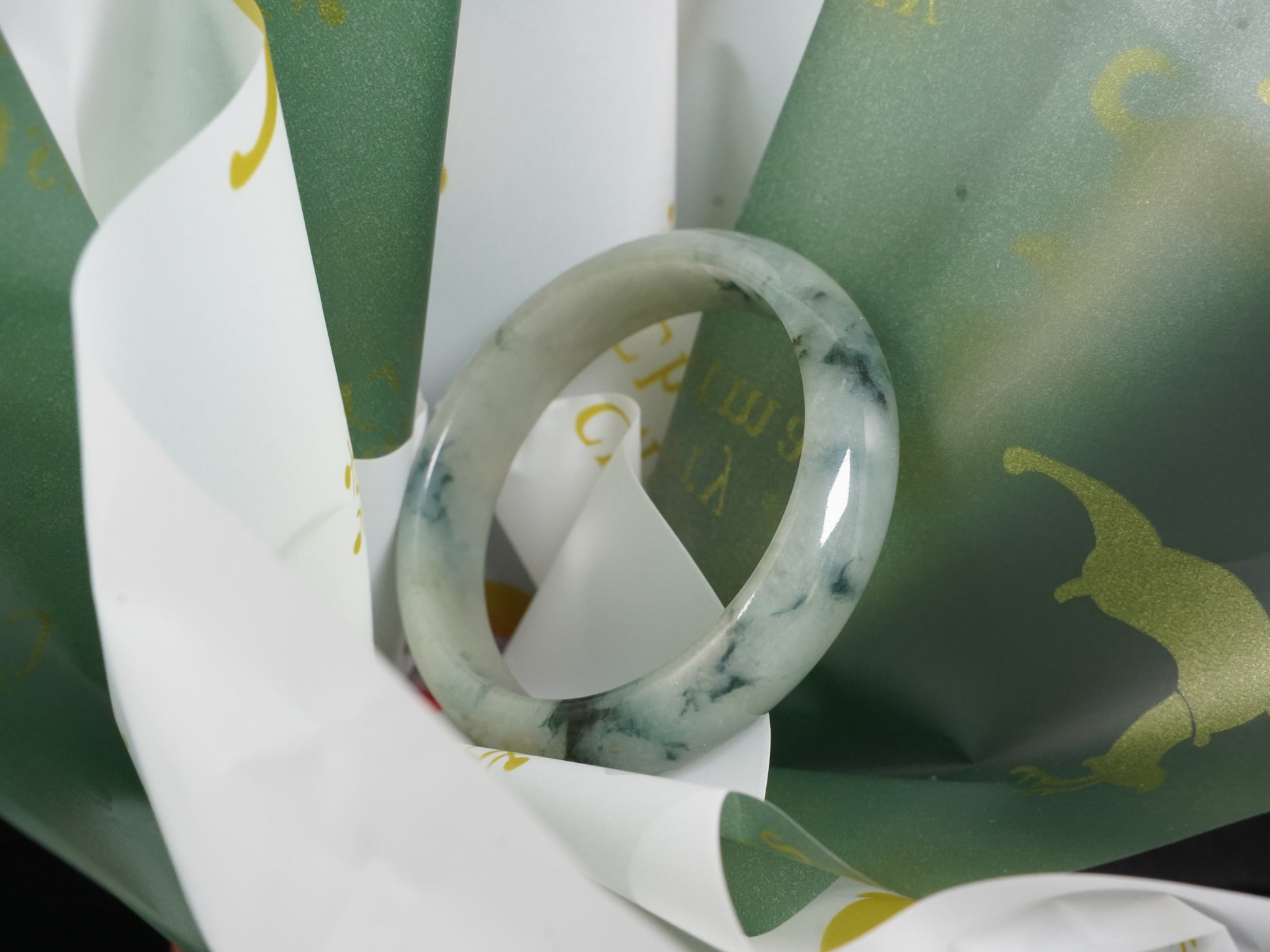 A misty teal veins jadeite bangle.