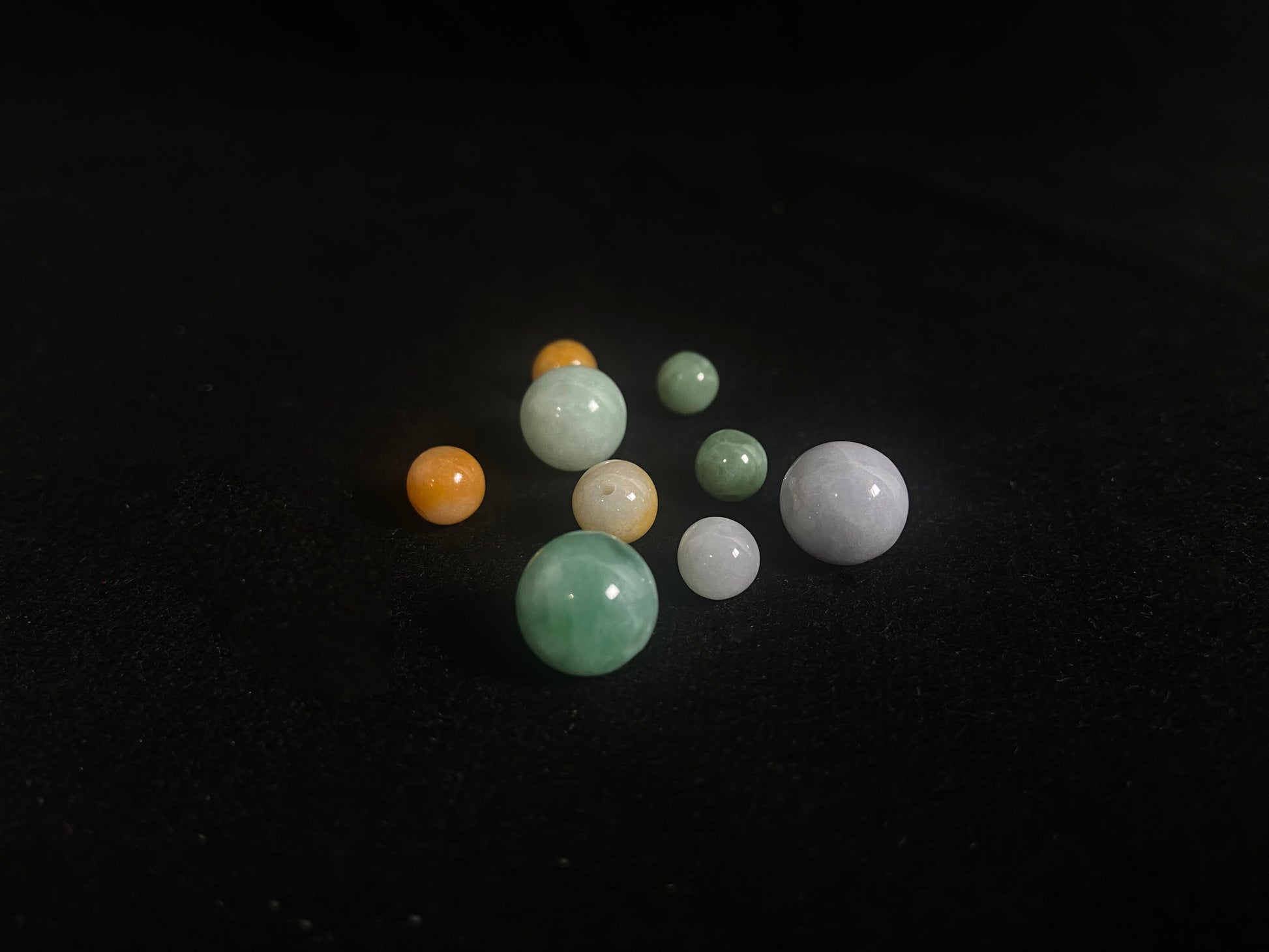Set of jade beads on a dark background