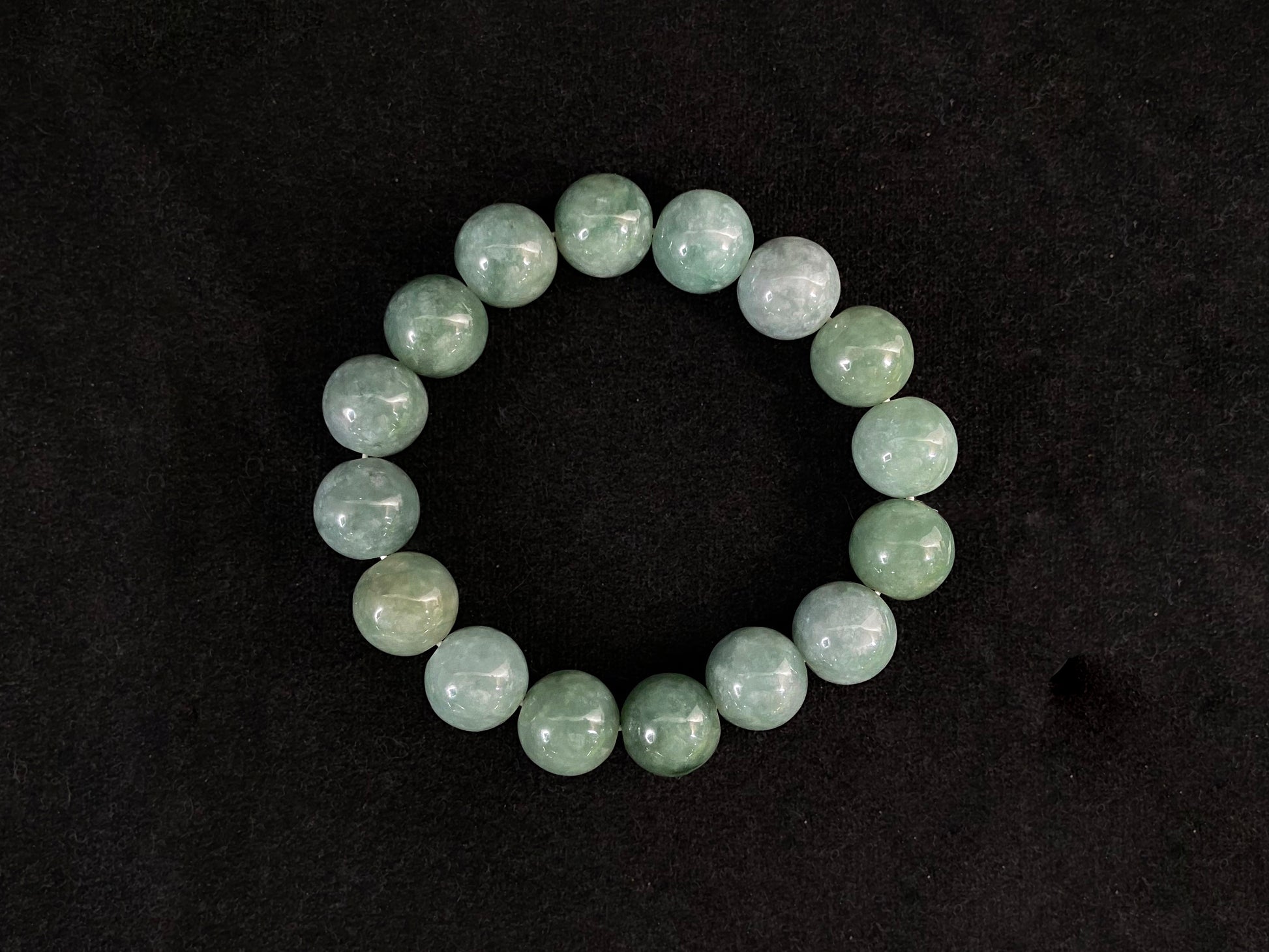 This jadeite bead strand consists entirely of white green beads.