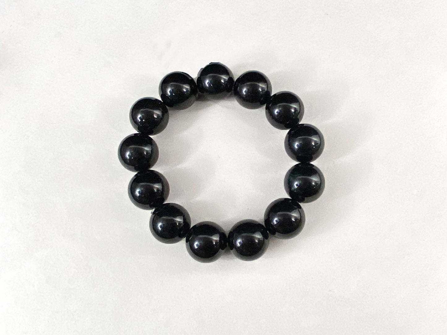All beads on this jadeite strand are black jade beads.