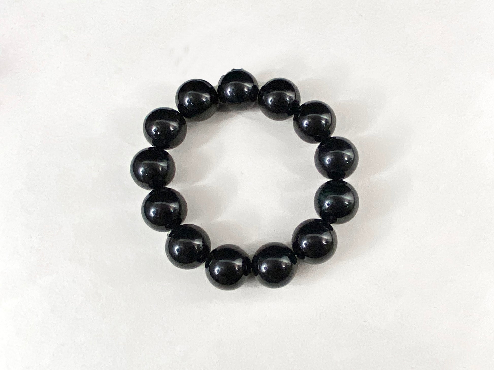 All beads on this jadeite strand are black jade beads.