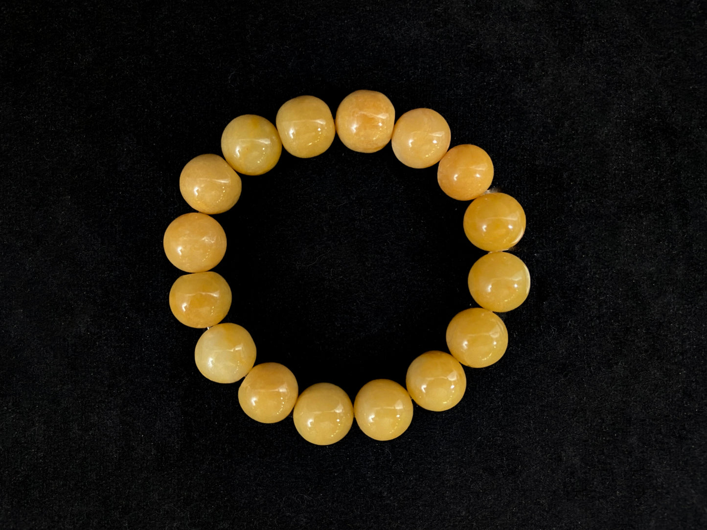 This jadeite bead strand features all yellow beads.