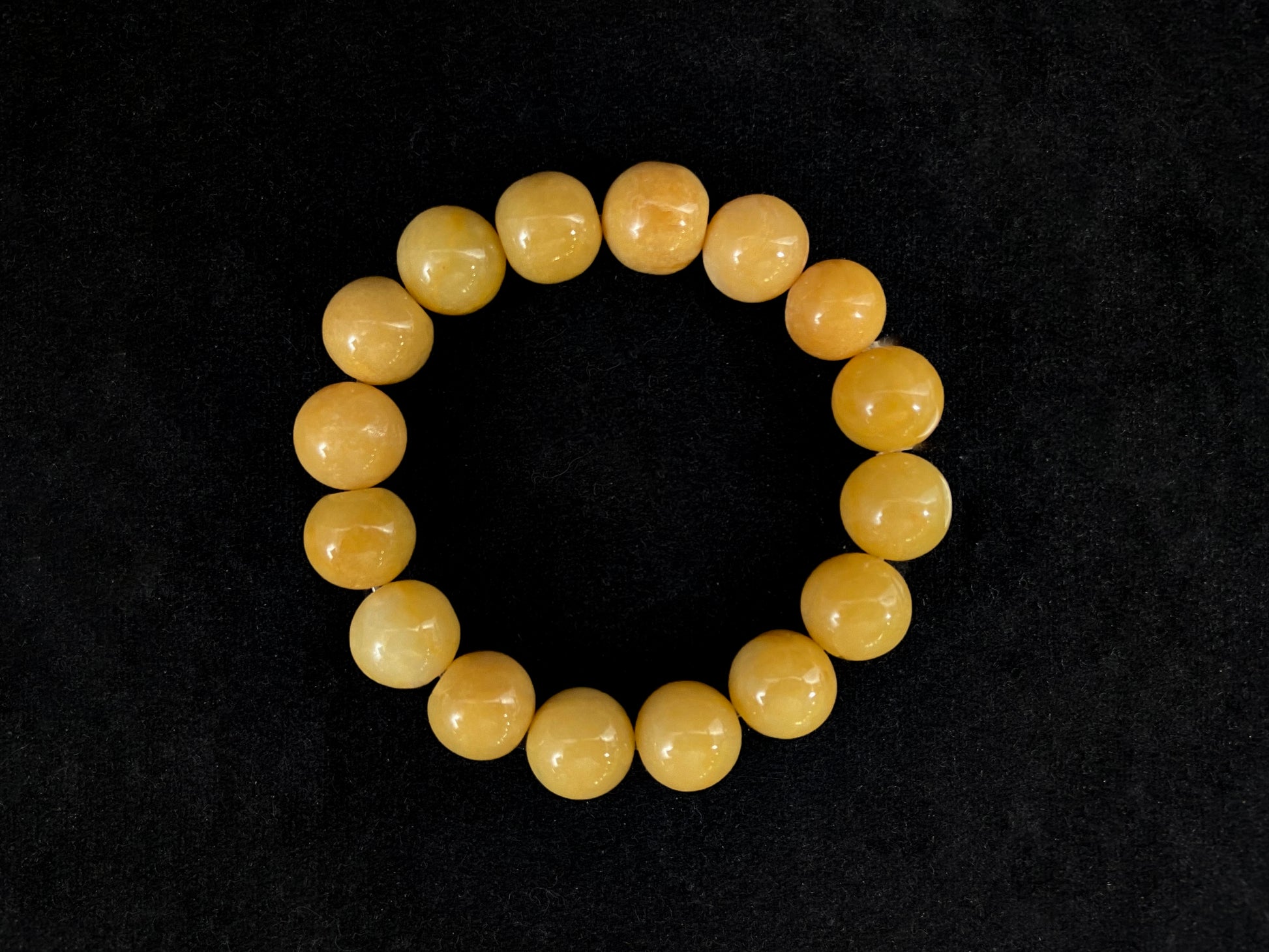 This jadeite bead strand features all yellow beads.