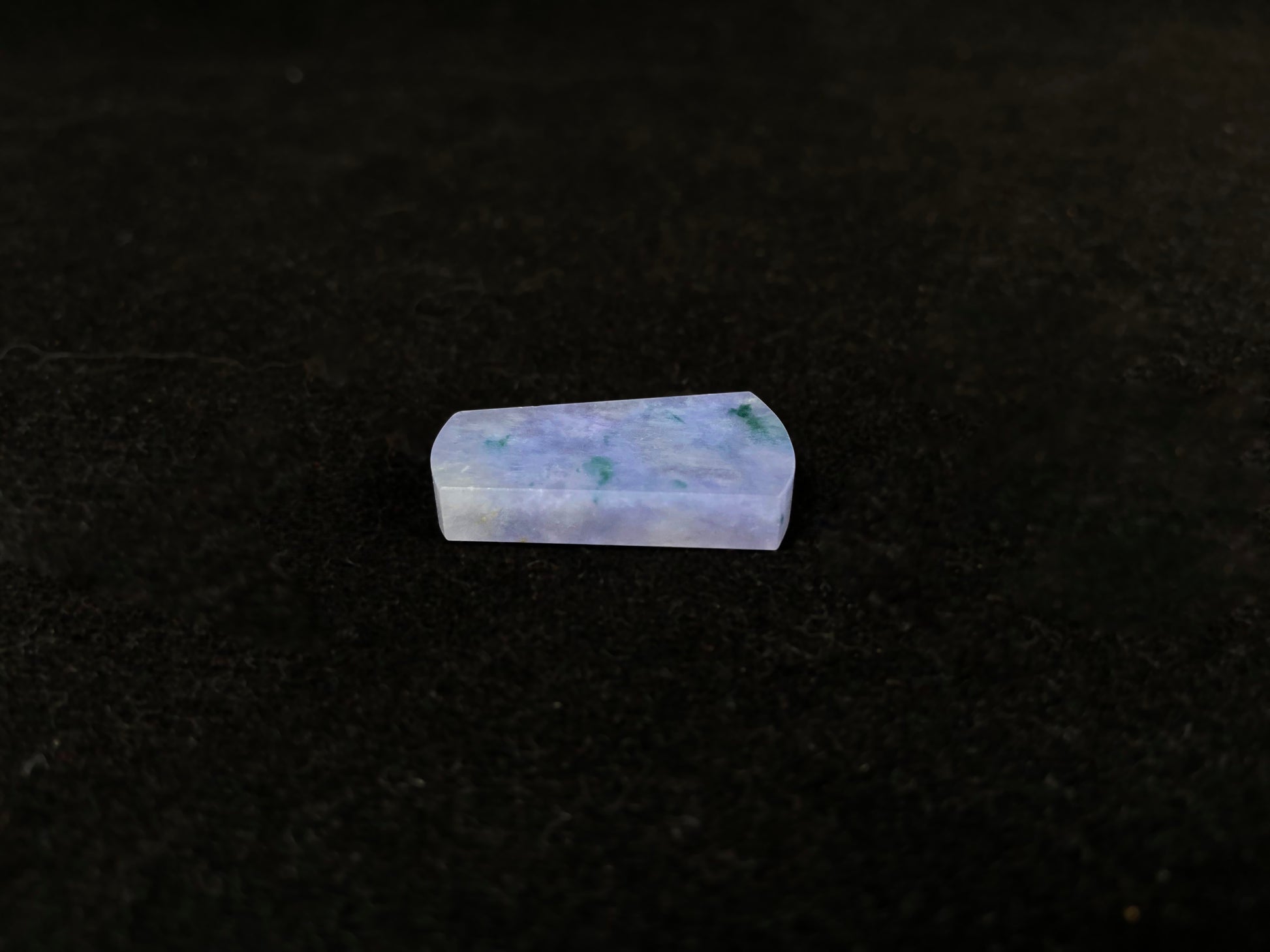 Lavender jade Wu Shi Pai with mossy green patterns.